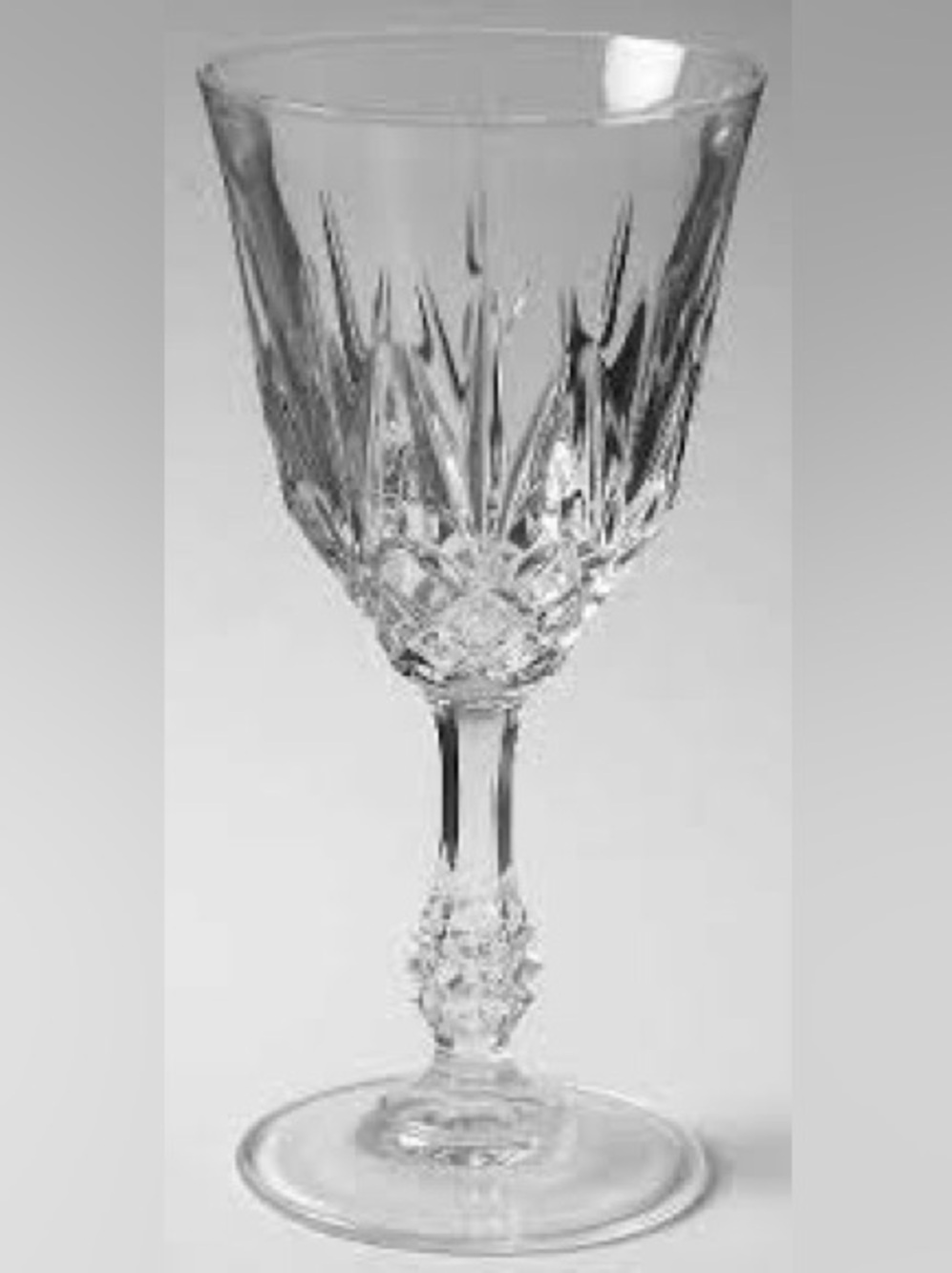A set of vintage crystal diamond pattern wine glasses.